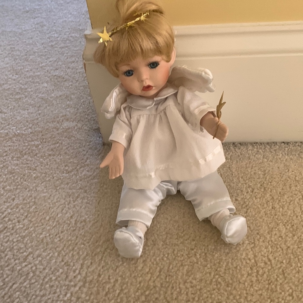Vintage porcelain angel doll that plays music
